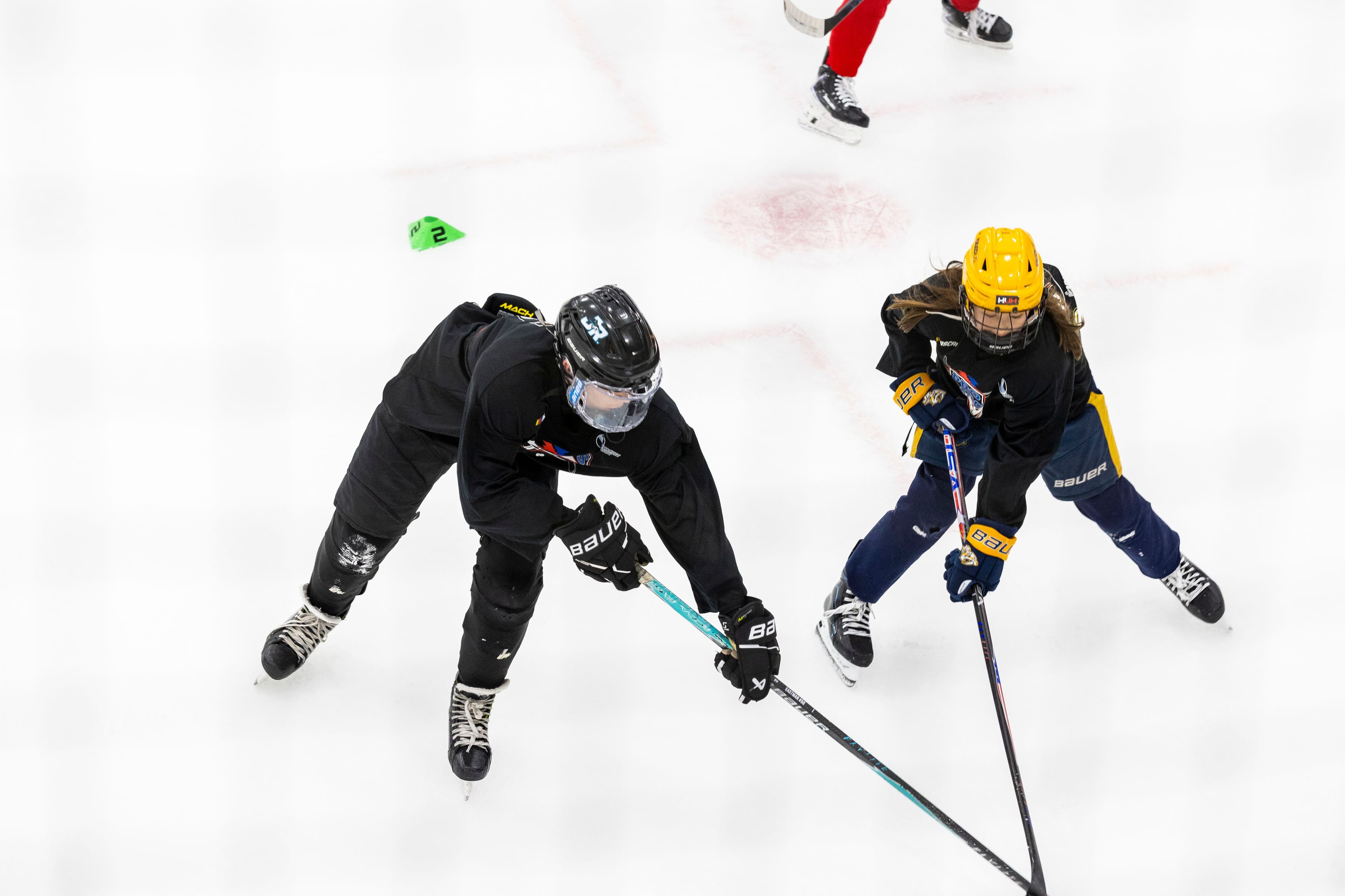 Two campers battling for the puck