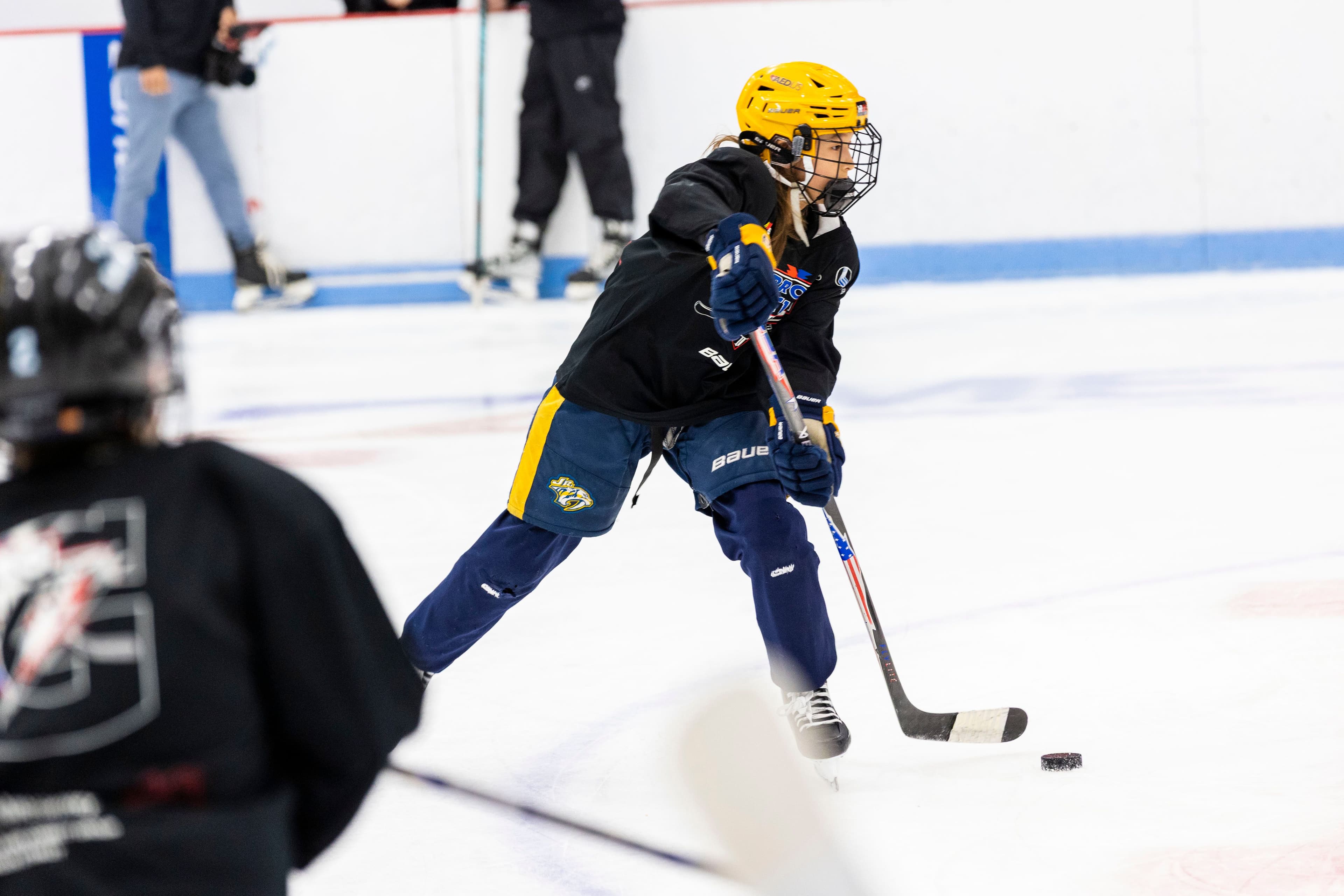 Camper carrying the puck
