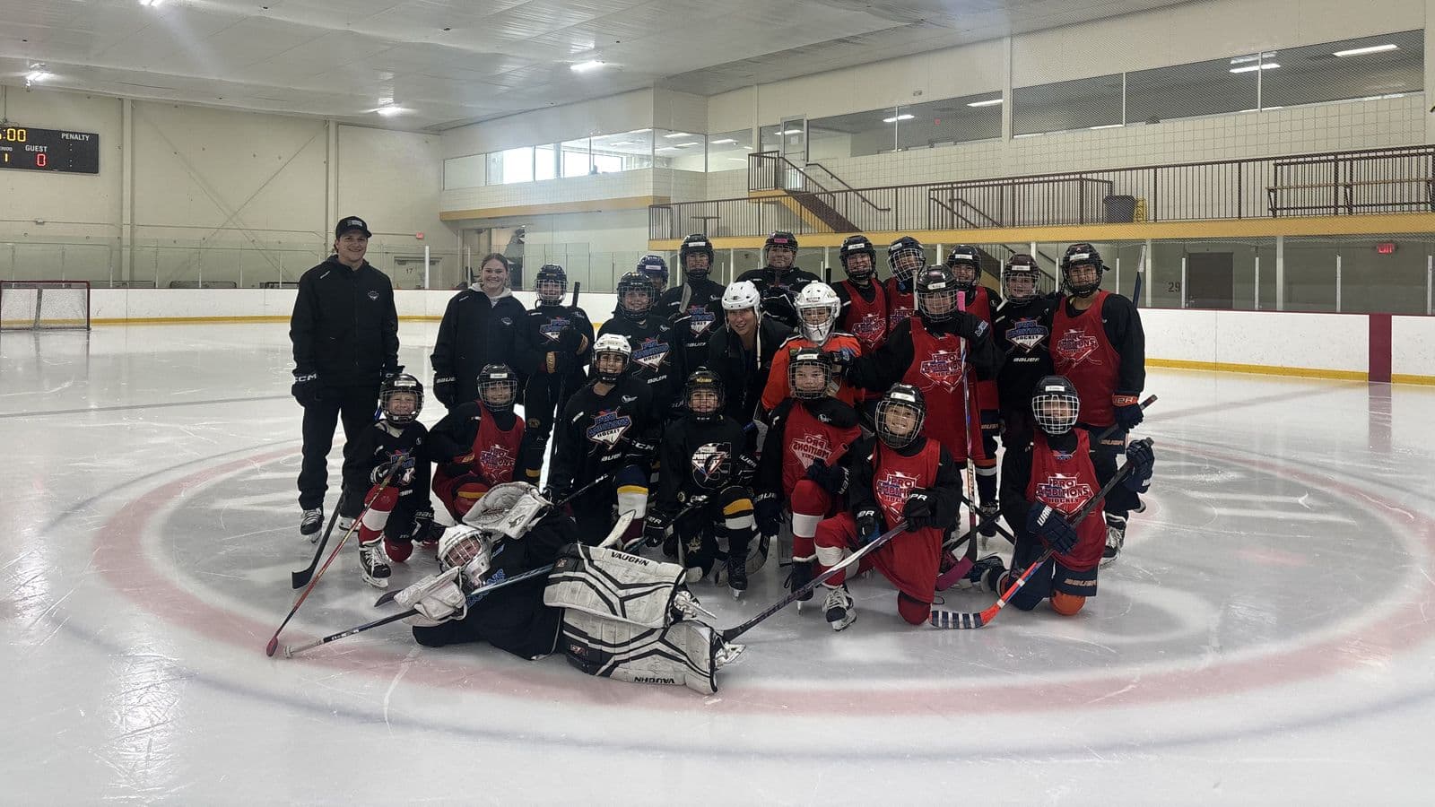 Girls camp team photo on the ice