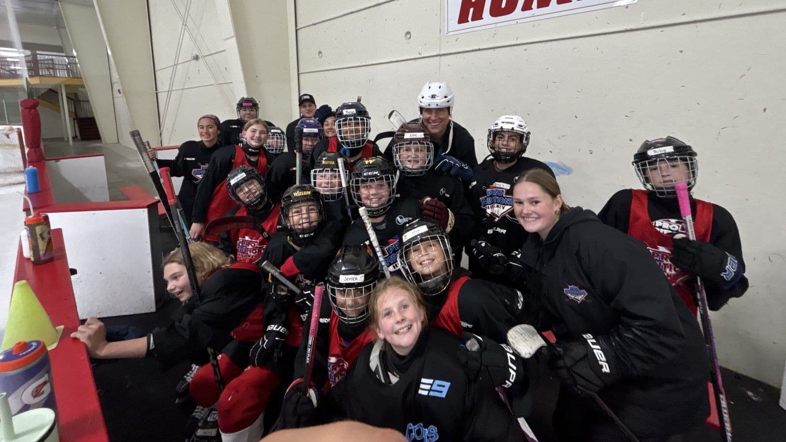 Field hockey campers with their coach