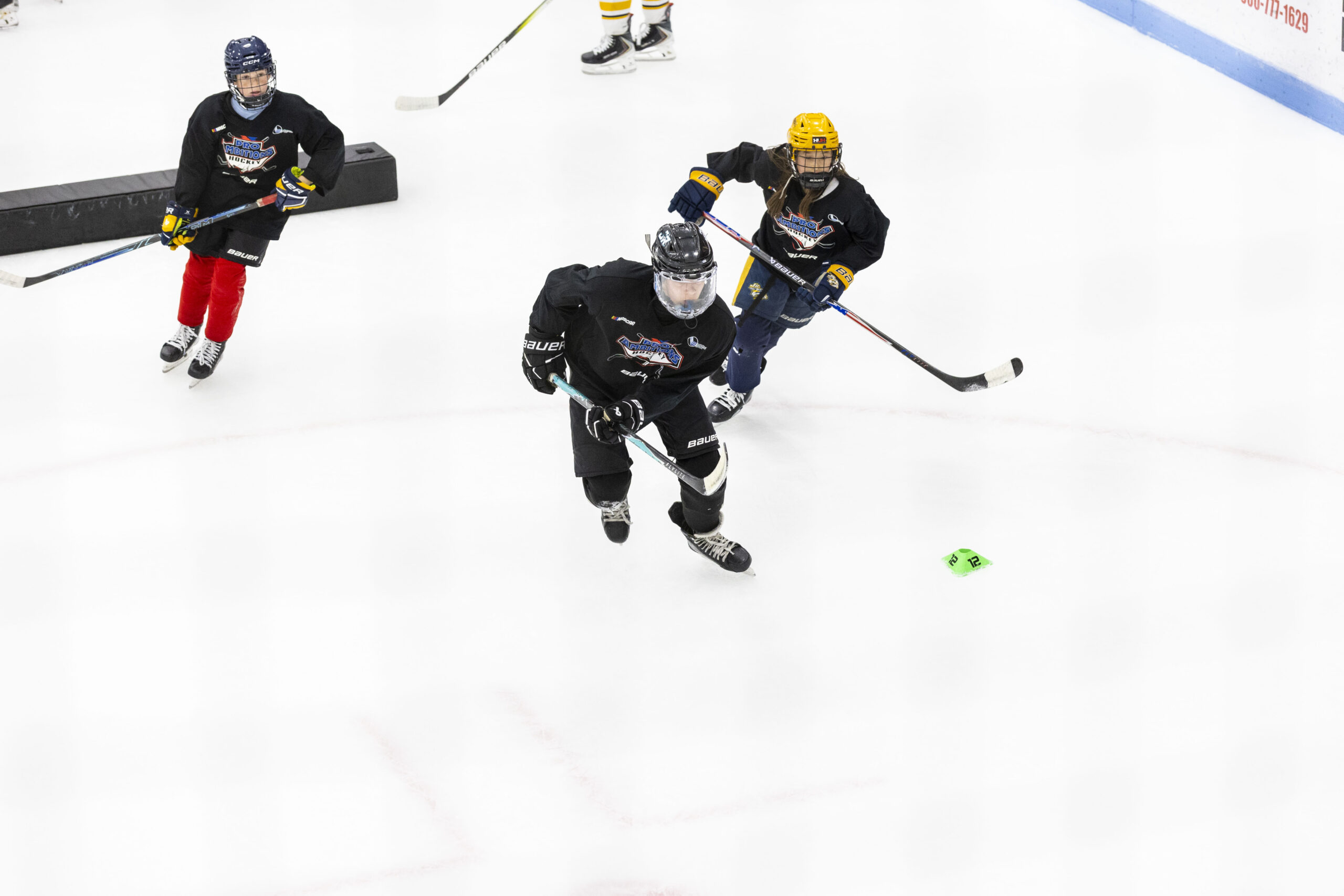 Pro Ambitions campers skating a drill